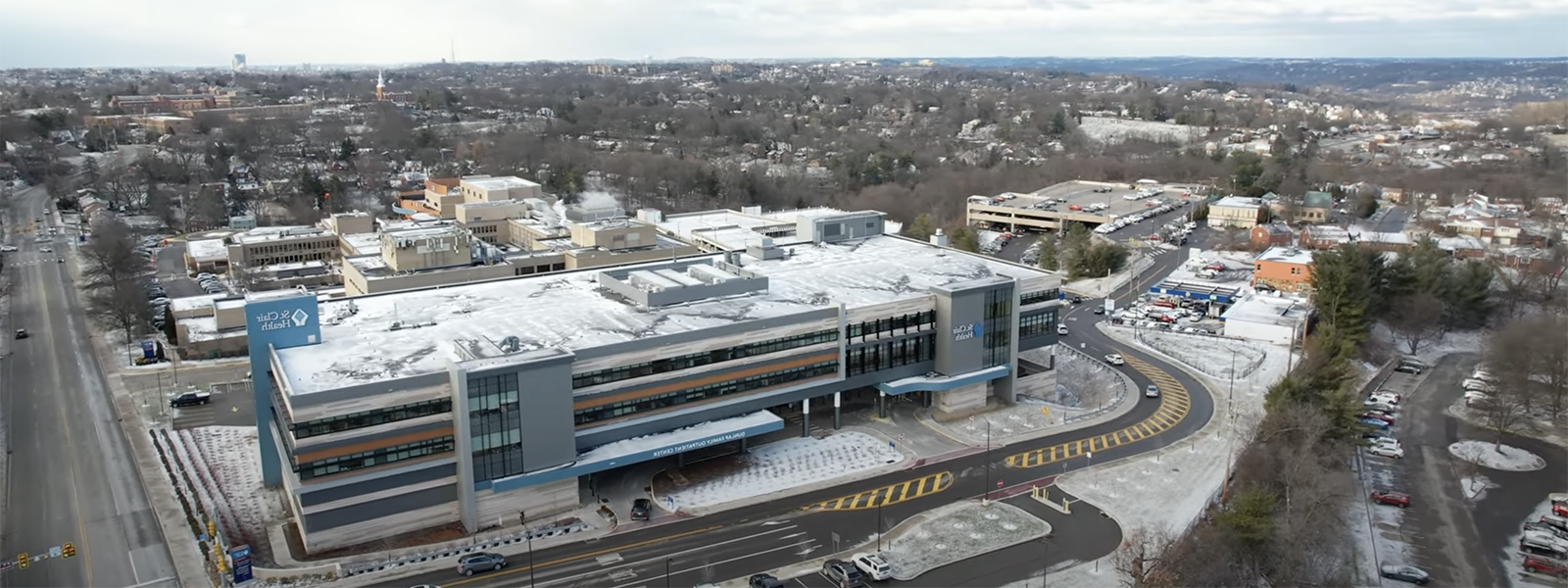 Aerial photo of a building and parking lot in winter